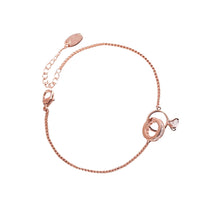 Load image into Gallery viewer, Image shows rose gold Amadeus Charm Bracelet on a white background.
