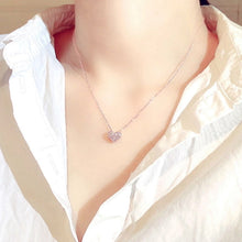 Load image into Gallery viewer, Image shows rose gold-finish Elizabeth Heart Necklace resting on model.