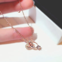 Load image into Gallery viewer, Image shows Lisa Heart Bracelet resting on model's fingers.