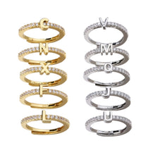 Load image into Gallery viewer, Image shows examples of gold and silver-tone Renee Letter Rings against a white background.