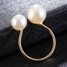 Load image into Gallery viewer, Image shows gold-tone Bexley Pearl Ring on a black surface.
