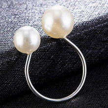 Load image into Gallery viewer, Image shows a silver-tone Bexley Pearl Ring on a black surface.
