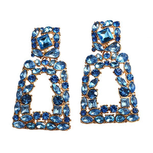 Image shows Blue Sparkle Jenny Drop Earrings product photo on white background.