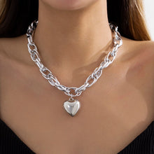 Load image into Gallery viewer, Image shows gold-finish Cathy Heart Necklace on model.
