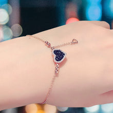 Load image into Gallery viewer, Image shows Clarissa Charm Braclet on model&#39;s wrist.
