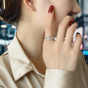 Image shows gold finish Cynthia Ring on model's finger.
