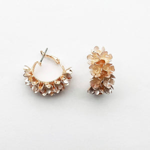 Image shows Blush Erica Drop Earrings against a grey background.