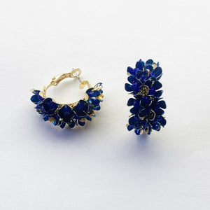 Image shows Midnight Blue Erica Drop Earrings against a grey background.