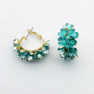 Image shows Pure Azure Erica Drop Earrings against a grey background.