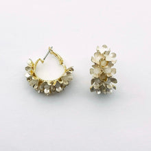 Load image into Gallery viewer, Image shows Soft White Erica Drop Earrings against a grey background.

