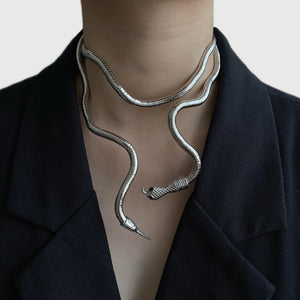 Image shows silver-tone Esme Serpent Necklace on model's neck.