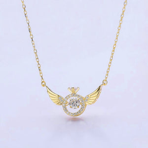 Image shows gold-finish Gloria Angel Necklace on a grey background.