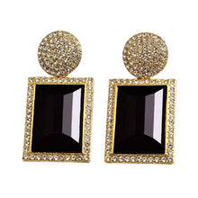 Load image into Gallery viewer, Image shows black and gold Margot Statement Earrings on a white background.
