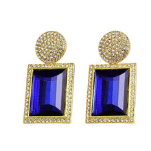 Load image into Gallery viewer, Image shows blue and gold Margot Statement Earrings on a white background.
