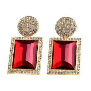 Image shows red and gold Margot Statement Earrings on a white background.