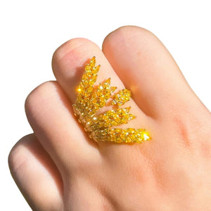 Image shows Miriam Starburst Ring on model's finger.