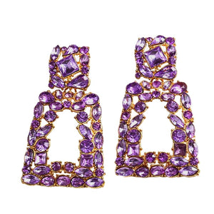 Image shows Purple Sparkle Jenny Drop Earrings product photo on white background.