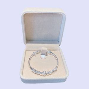 Image shows the Wendy Bracelet in a beige-coloured box.