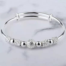 Load image into Gallery viewer, Image shows the Wendy Bracelet on a grey marbled background.
