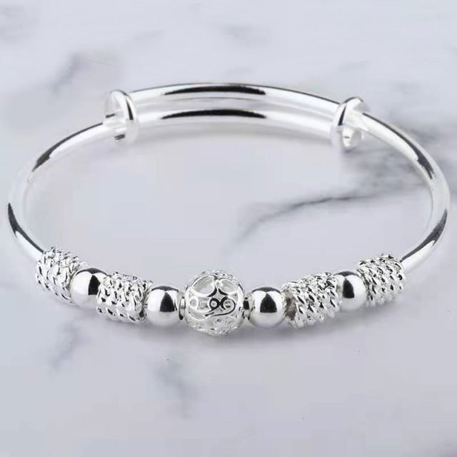 Image shows the Wendy Bracelet on a grey marbled background.